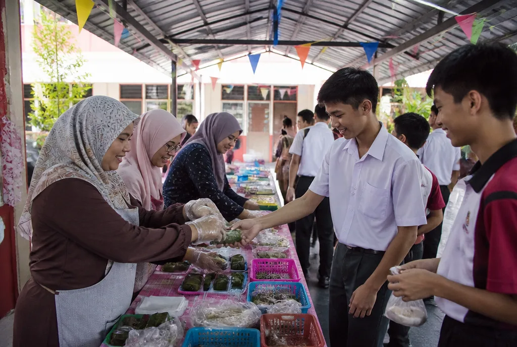 Parents run a stall at the school fun fair.
