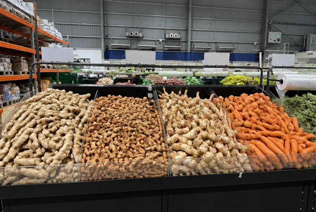 Crates of ginger, turmeric, galangal and carrots