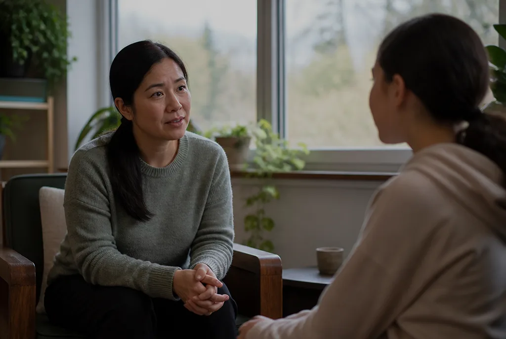 Hannah Tran talking with a teenage patient