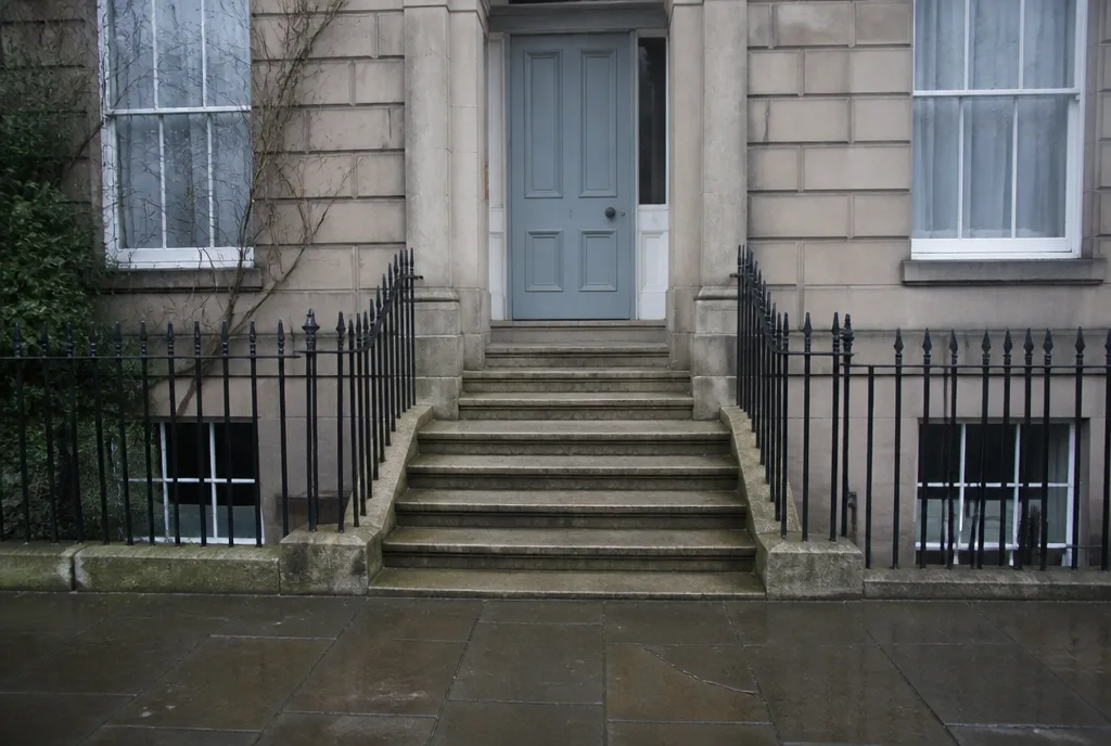 Stone steps and railings up to the clinic door