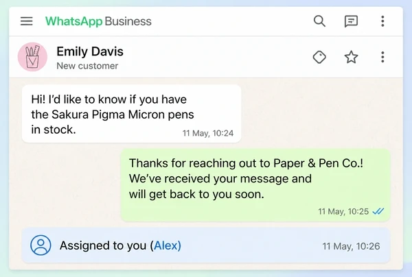 A WhatsApp Business inbox for a stationery brand with an enquiry, an automatic reply and an assignment