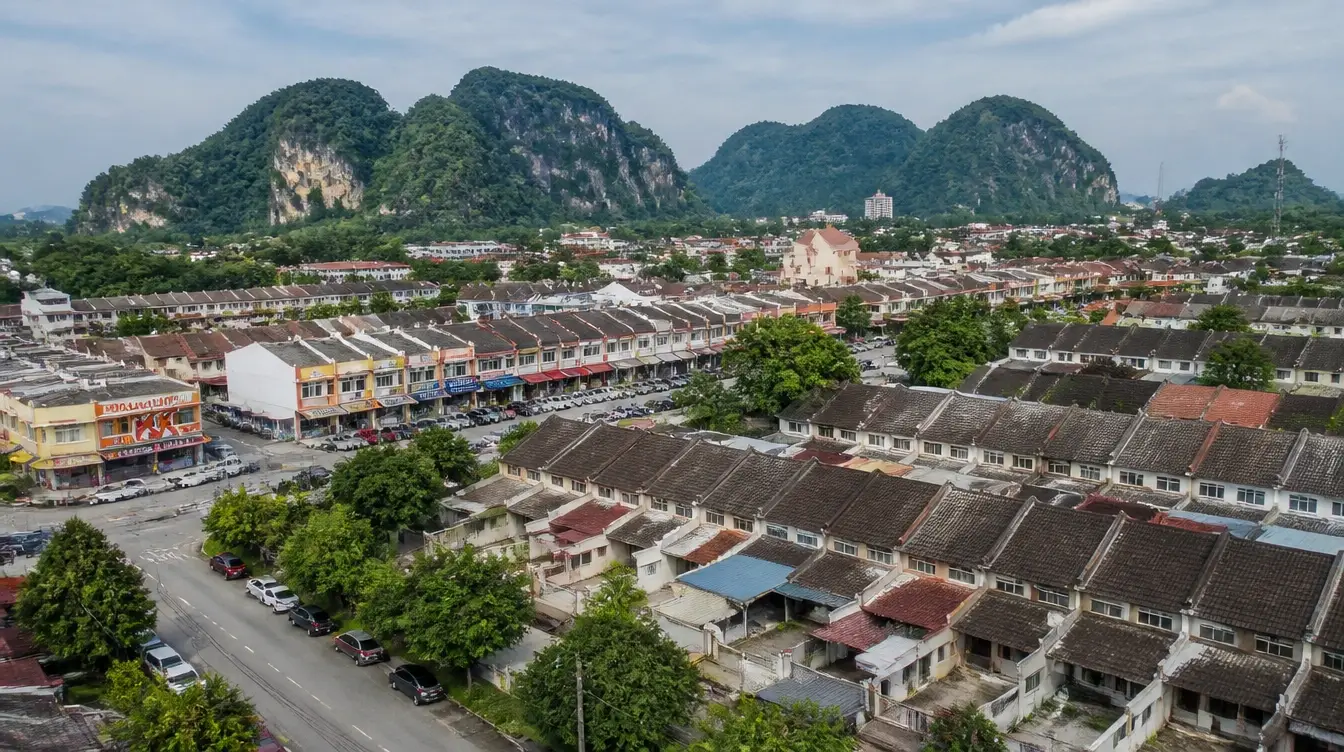 An overview of Bercham in Ipoh, terraced housing rows with the limestone hills beyond