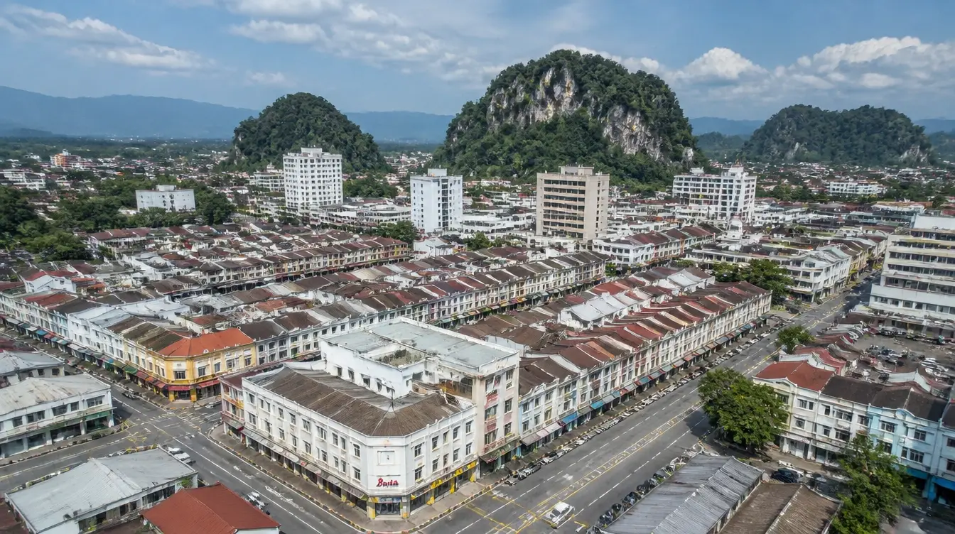 An overview of Ipoh New Town, the commercial centre with the limestone hills beyond