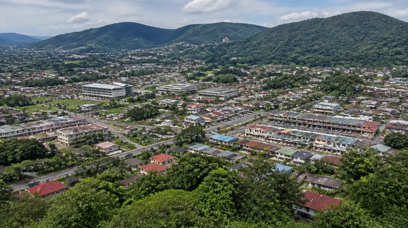 An overview of Penampang in Sabah, suburban housing in the valley below forested hills