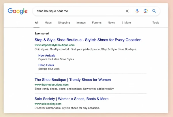 A Google results page with one sponsored shoe boutique advert above two organic results