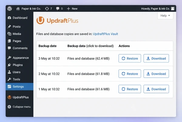 An UpdraftPlus screen for a stationery brand website listing three dated backups with restore buttons